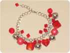 Bettelarmband silber mit roten Perlen